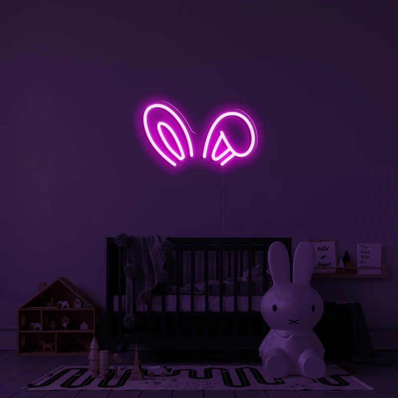 Logotipo de néon brilhante 3D em uma parede - orelhas de coelho