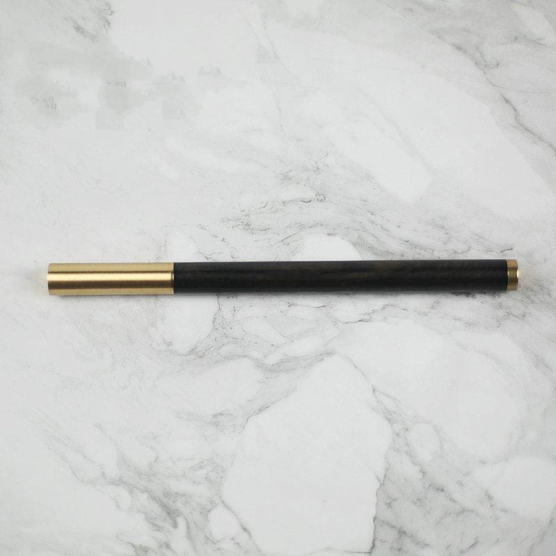 caneta esferográfica dourada com madeira